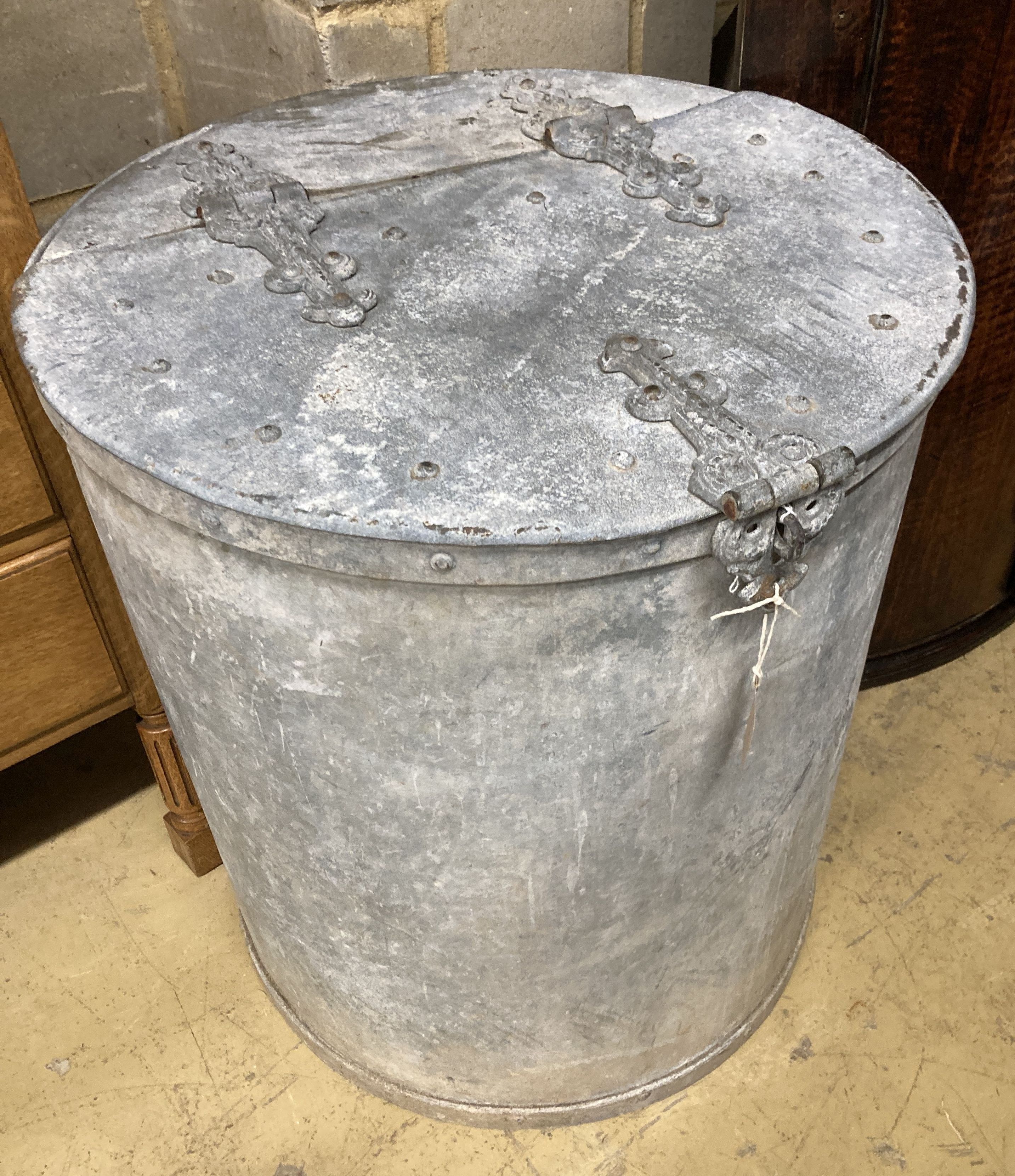 A large Victorian circular galvanised lidded barrel, 66cm high, 58cm diameter